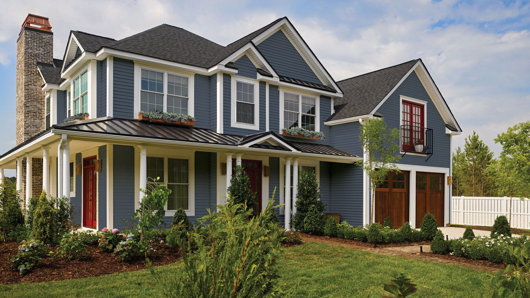 Home With Blue CertainTeed Vinyl Siding And Red Front Door