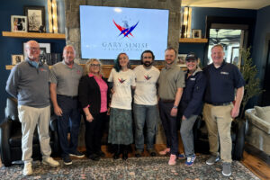 Home Genius team members with Retired U.S. Army Sgt. Mary Dague, an honoree of the Gary Sinise Foundation's R.I.S.E. program