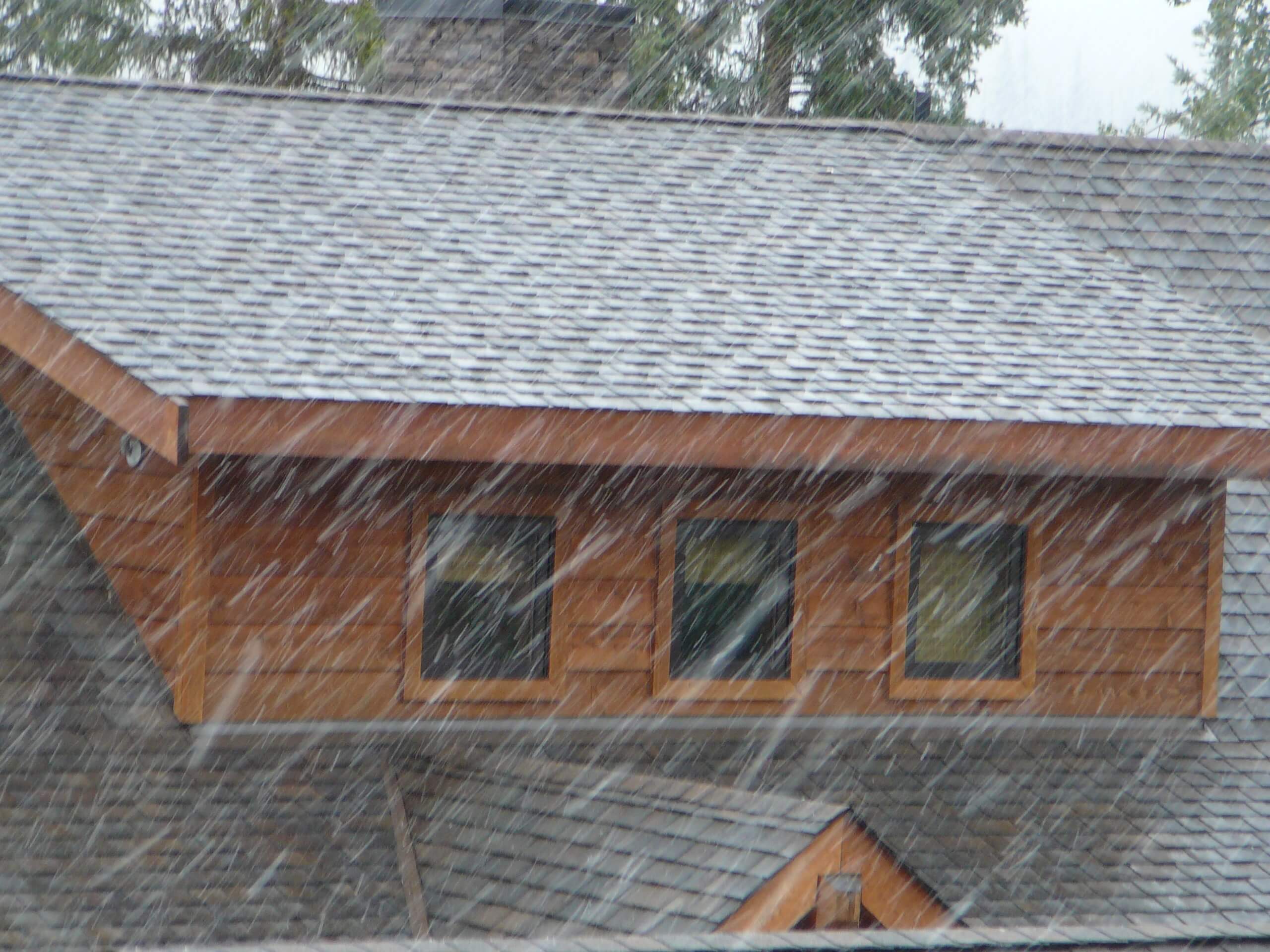 heavy wind and rain on a roof