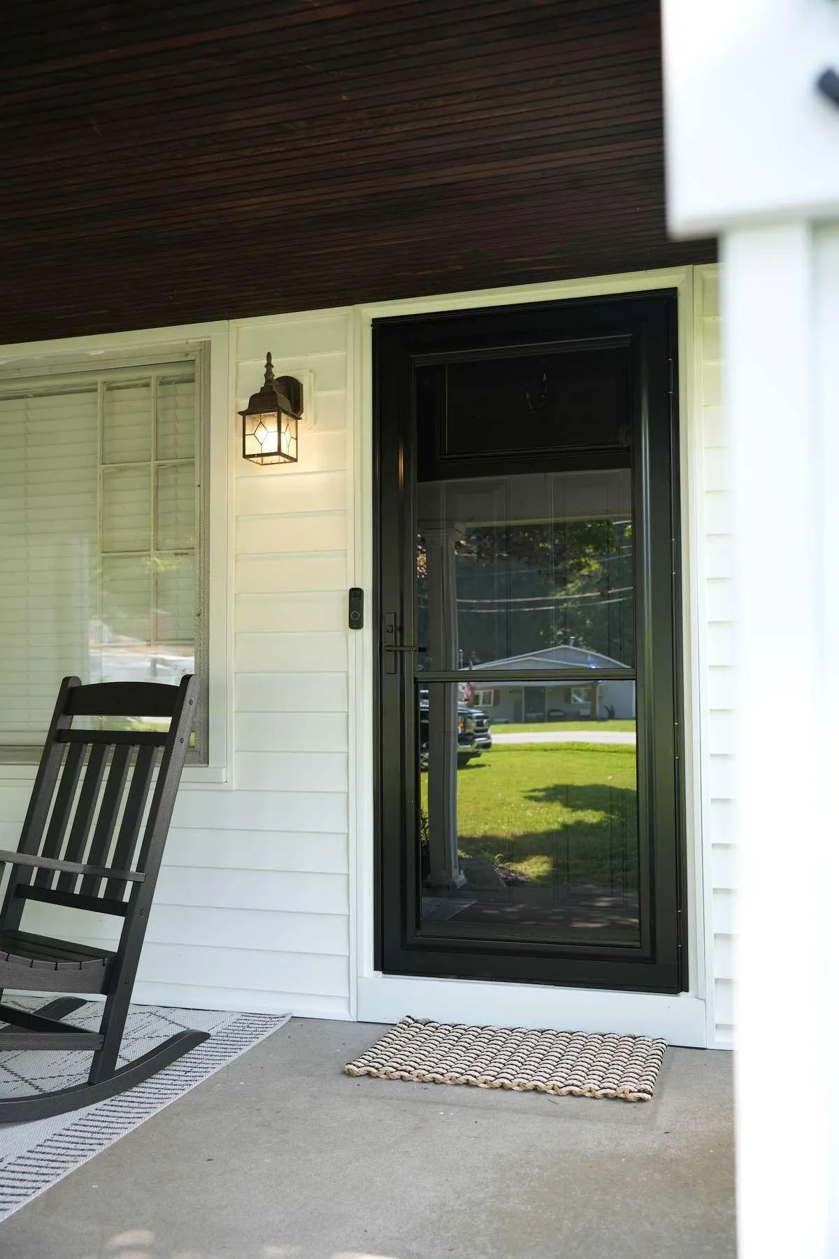 A storm door fitted trim to trim in its entry opening, the snug fit a correct measurement gives.
