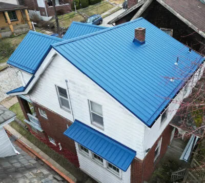 Bright blue metal roofing system installed by HGE