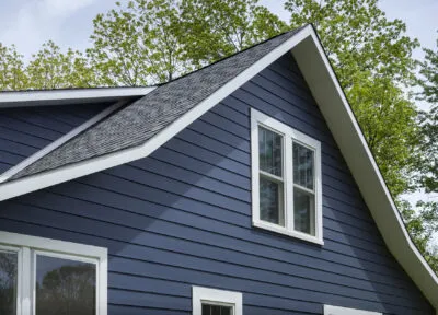 Close up of blue fiber cement siding