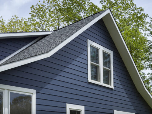 Close up of blue fiber cement siding