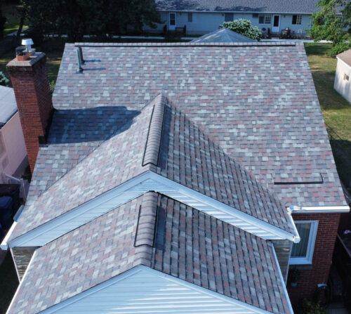 Multi-colored gray asphalt shingle roof project completed by HGE