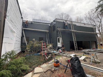 In progress photo of a siding remodeling project on a modern home