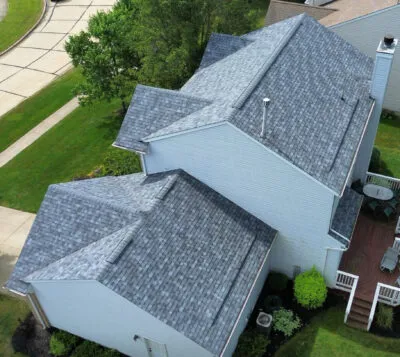 Aerial shot of gray asphalt roofing installation project