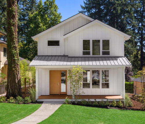 Metal Roof On A White Two Story Home