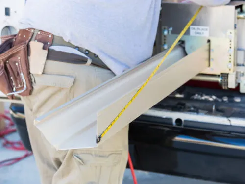 Home Genius Exteriors gutter replacement specialist custom fabricating K-style gutters for a same-day install.