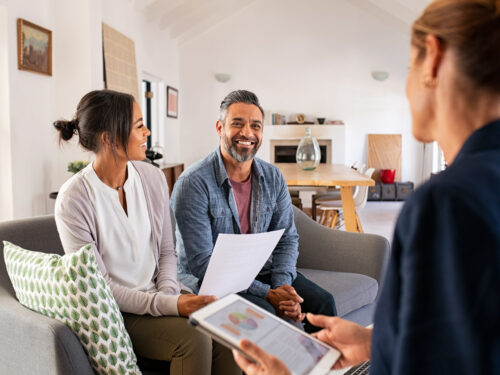 Homeowners Discuss Financing With Project Coordinator