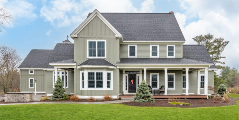 Home With Green Hardie Fiber Cement Siding