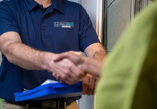 Home Genius Exteriors Remodeling Specialist Shakes Homeowner's Hand