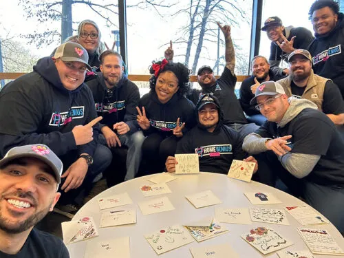 group photo of HGE team members at an HGE Cares volunteering event