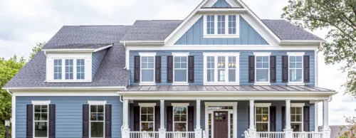 a front shot of a beautiful home in North Carolina with blue siding