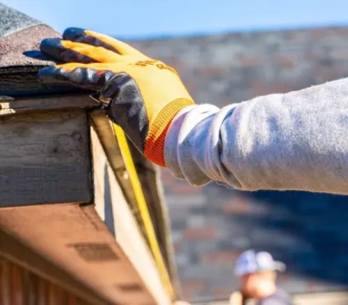 tech measuring roof edge for gutter system