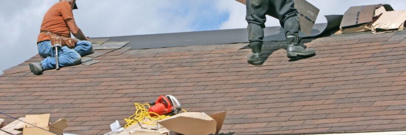 Men replacing a roof