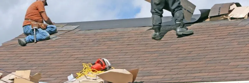 Men replacing a roof
