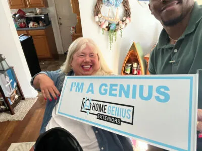 HGE customer selfie with "I'm a Genius" sign