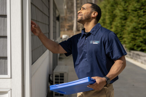 HGE employee performing a home inspection