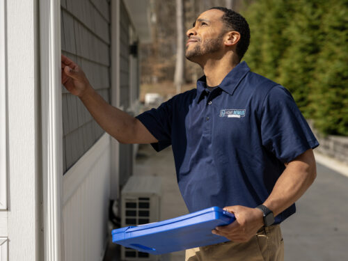 HGE employee performing a home inspection