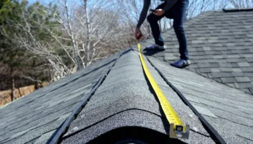 Roof being measured during inspection