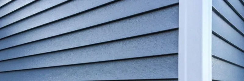 Close up of blue vinyl siding
