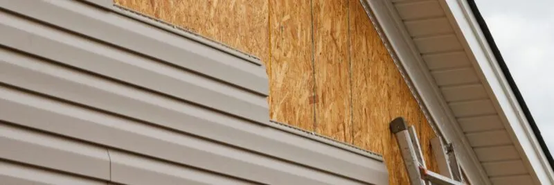 close up of siding being removed during replacement