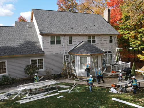 Far off shot of an in-progress siding installation job