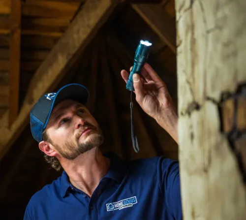Home Remodeling Expert performing an attic inspection