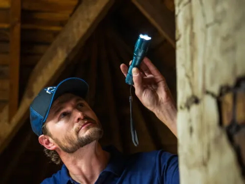 Home Remodeling Expert performing an attic inspection