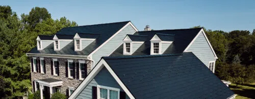 metal shingle roofing on a suburban home