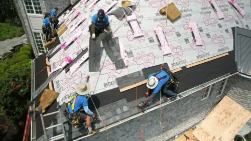 HGE team members installing a new roof