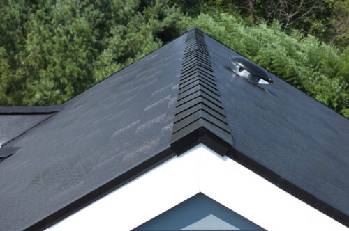 close u of the vent caps on a metal shingle roof