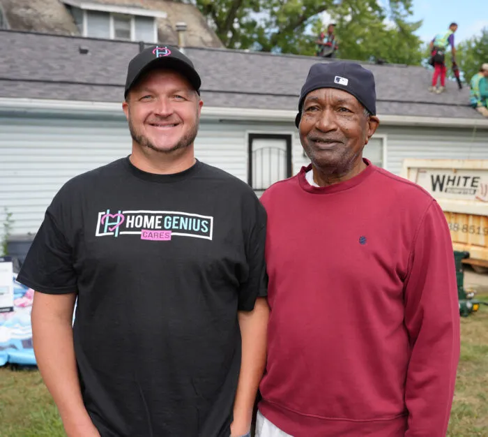 Co-Founder Brent Miller posing with a recipient of a free roof deployment