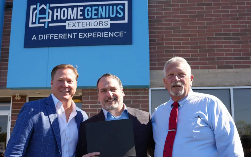Jeff Gunhus, Tim Dunphy, and the Mayor of Streetsboro posing together outside the HGE corporate HQ