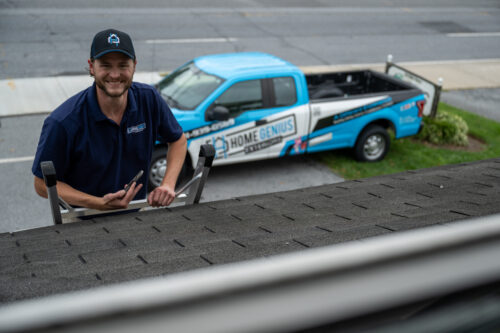 Home Genius Exterior Project Manager inpecting completed roof installation