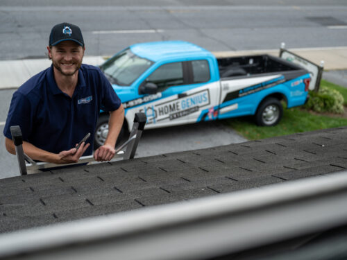 Home Genius Exterior Project Manager inpecting completed roof installation