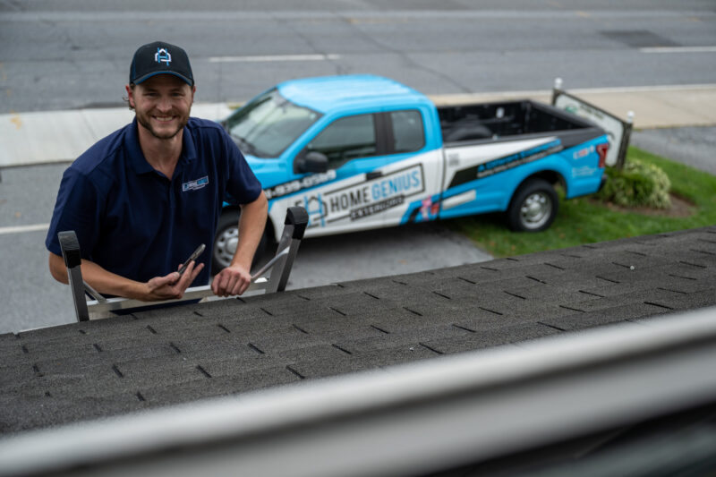 Home Genius Exterior Project Manager inpecting completed roof installation