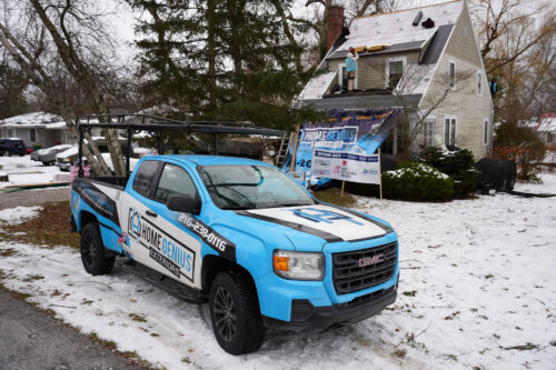HGE branded truck outside a home