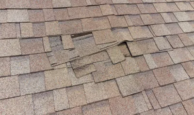 What To Do About Wind Damage To Your Roof (And How To Spot It)