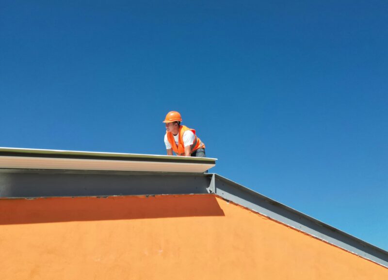 man working on roof