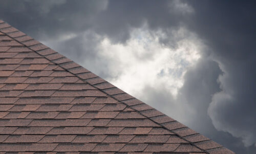 dark storm clouds behind a roof