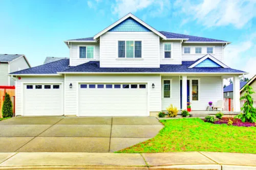 Luxury two level house exterior with garage and concrete driveway. Northwest, USA